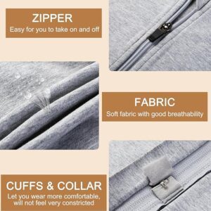 Close-up image of a grey trans man binder displaying its features: a zipper for easy use, soft and breathable fabric, and comfortable cuffs and collar. Water droplets on the fabric highlight its water-resistant properties. Text boxes describe these aspects in detail.