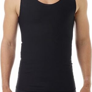 A man wearing a black, sleeveless full tank trans chest binder and black boxer briefs stands facing the camera with a neutral expression and his arms relaxed by his sides. The Underworks chest binder seamlessly blends into his attire against a plain white background.