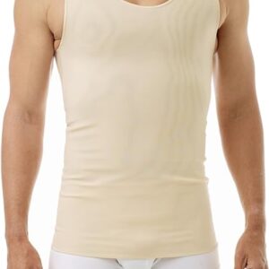 A man is wearing a beige full tank chest binder and white boxer briefs, with a trans chest binder subtly visible underneath. The photo captures his torso and upper thighs, standing against a plain white background.