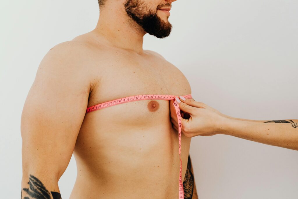 pexels-photo-5714312-5714312-1 Woman Measuring Man Chest with Tape
