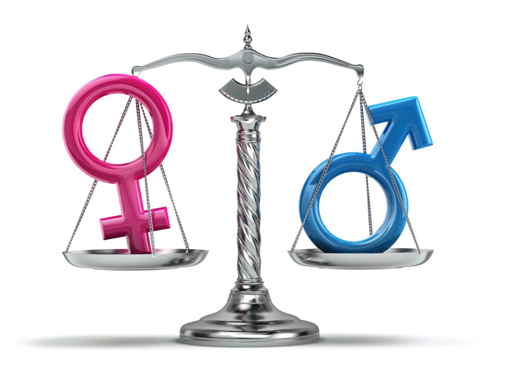 Sex vs gender A silver balance scale with the female symbol in pink on the left and the male symbol in blue on the right, representing gender equality across gender and science.