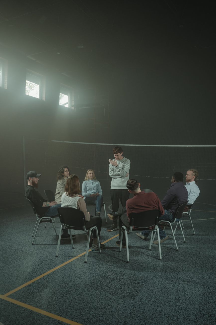 group of people sitting on chair