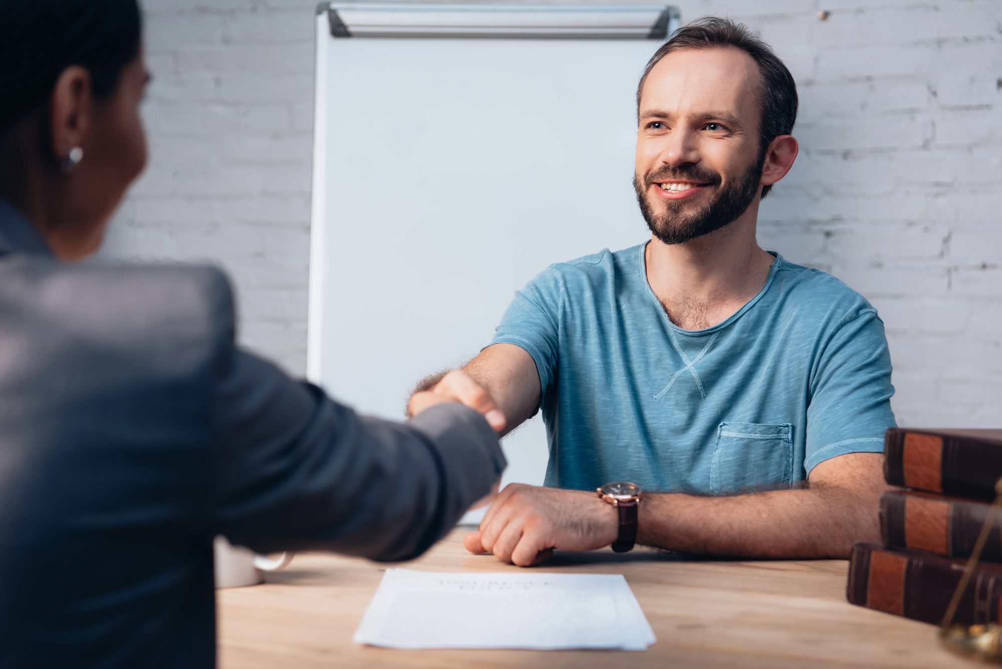 Legal-aid professional discussing documents with a client