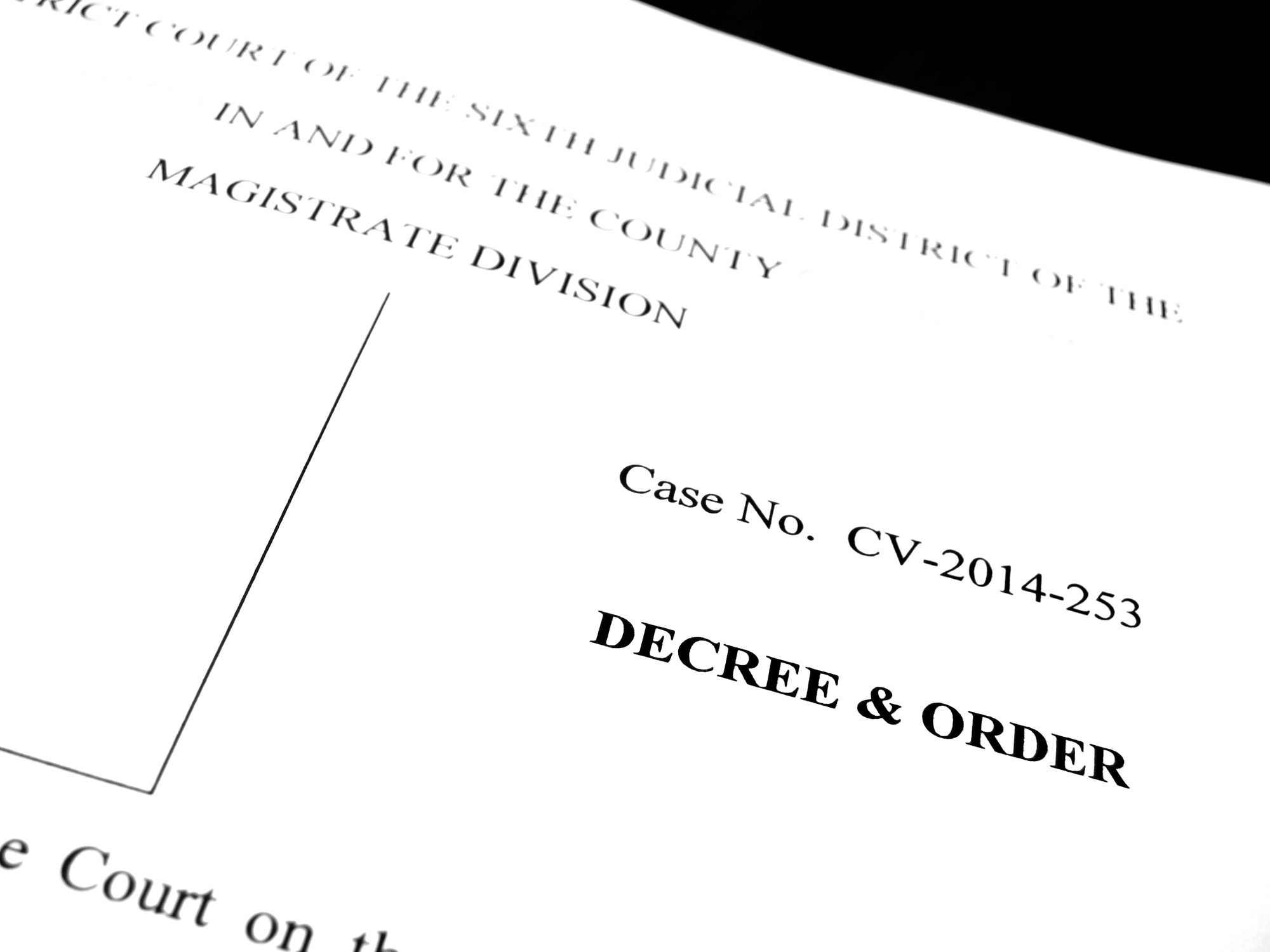 Person completing legal name-change paperwork beside identification documents