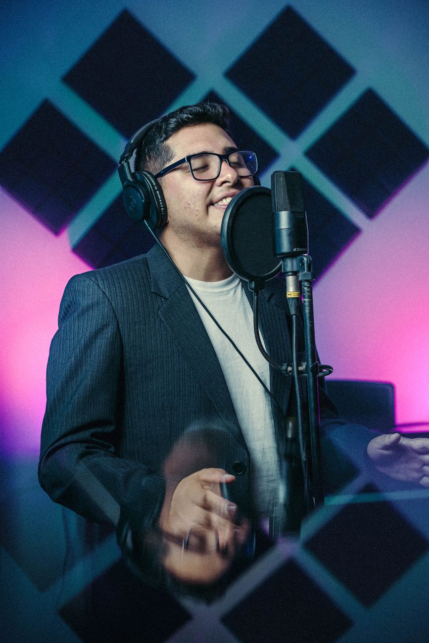 singer recording in professional studio