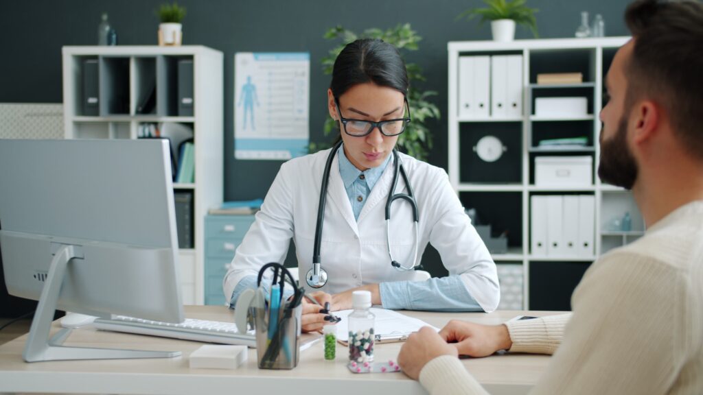 pexels-photo-39192384-39192384 A female doctor consulting a patient in a modern office setting.
