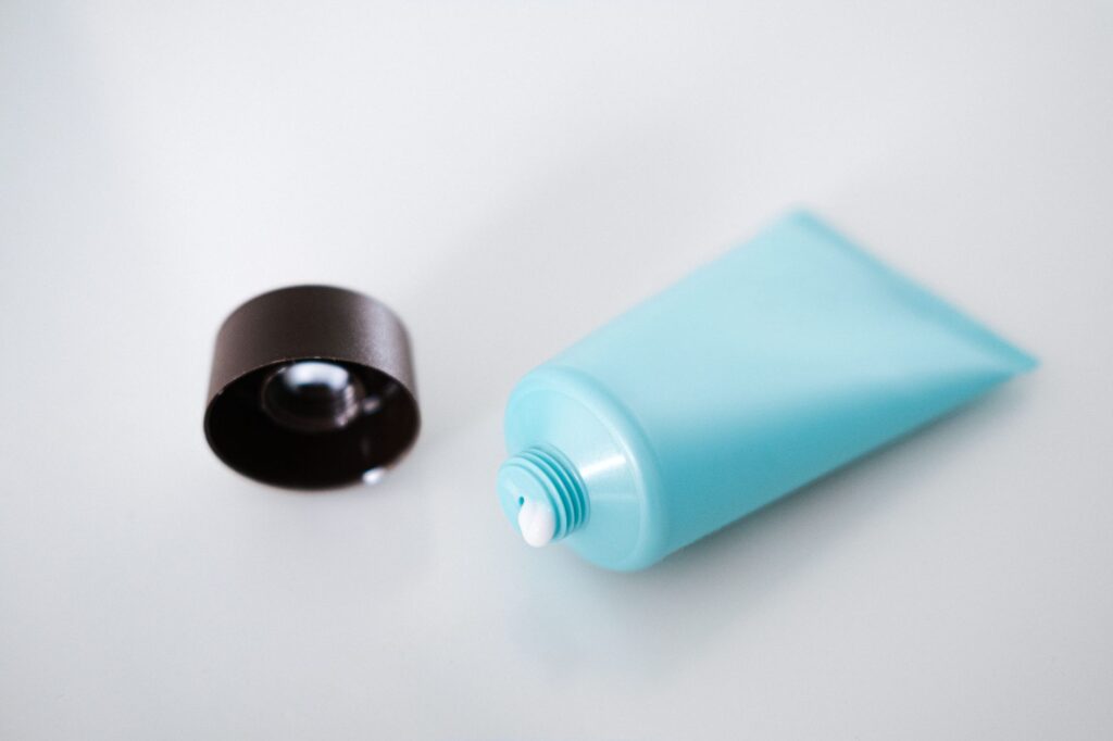 blue tube of lotion with plastic lid