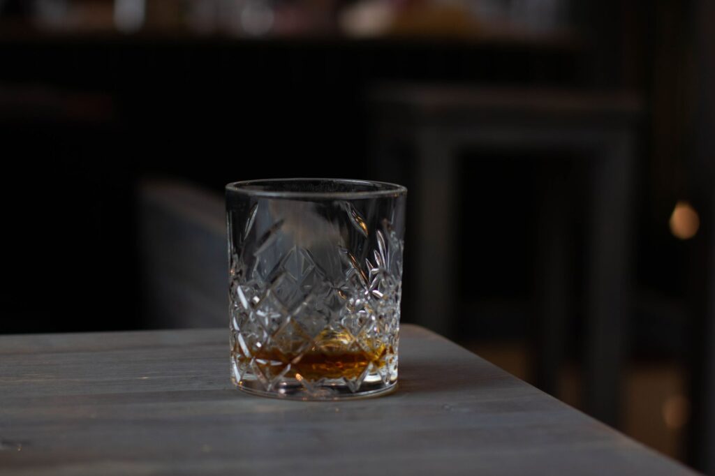 cognac on cut glass bottom placed on table