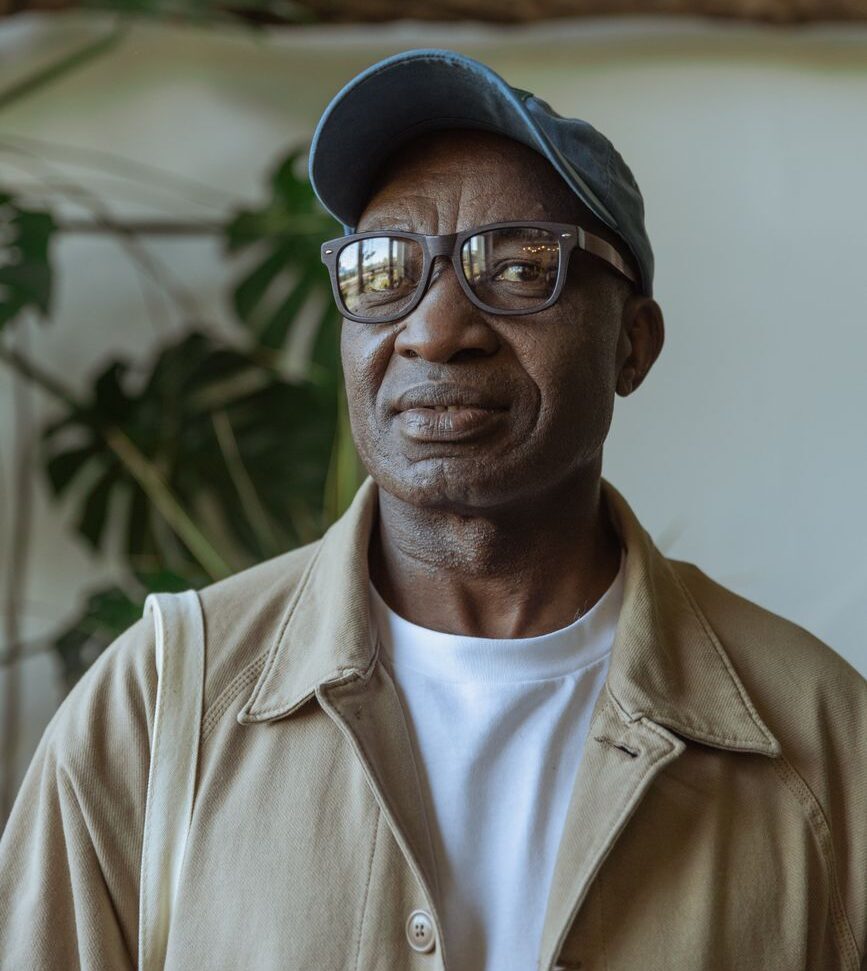photo of an old man wearing black framed glasses