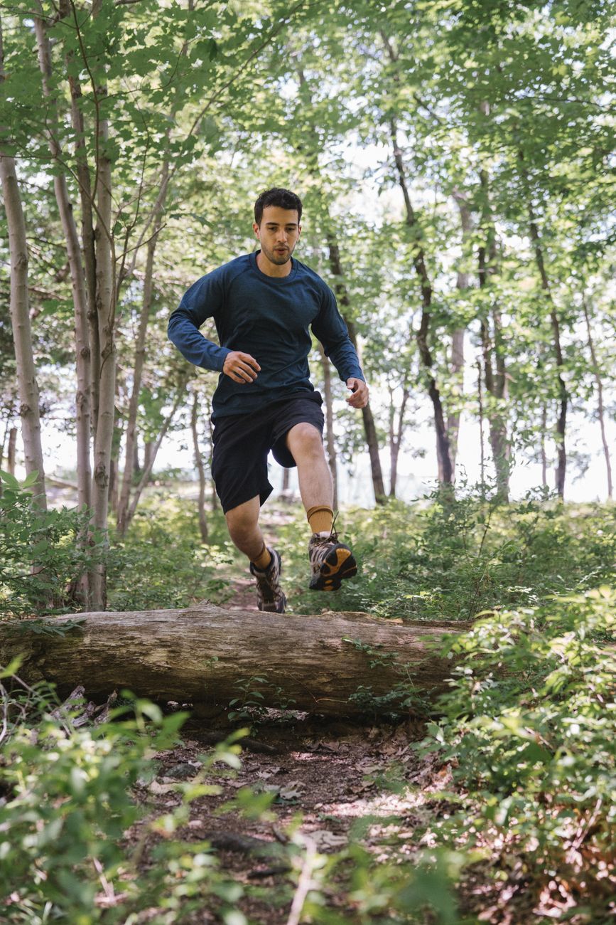 a man running in the forest